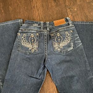 Adikd size 6 boot cut  jeans Inseam 32 waist has been taken in look at pictures